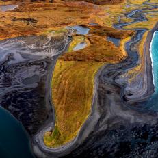 Only from a plane can you truly appreciate Alaska, its unique formations revealing themselves, such as this bay and beach in the interior of Kodiak National Wildlife Refuge on Kodiak Island. 