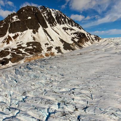 Skilak Glacier in Kenai National Wildlife Refuge, Alaska, is a massive glacier which reaches down from the Harding Icefield, where it is connected to the 39 other nearby glaciers. This has long been a favorite image of mine because of the emergence of a mountain peak which was most likely completely covered by snow and ice until relatively recently.
