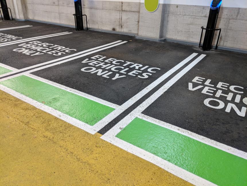 1017166138 Electric vehicle charging spaces in a multi storey car park.
