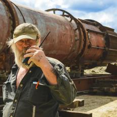 Tony Holding Walkie Talkie in front of the Trommel.