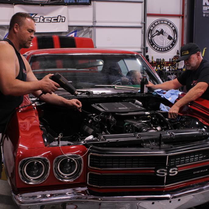 Ryan works on his 1970 Chevelle SS alongside Jeff Lutz.